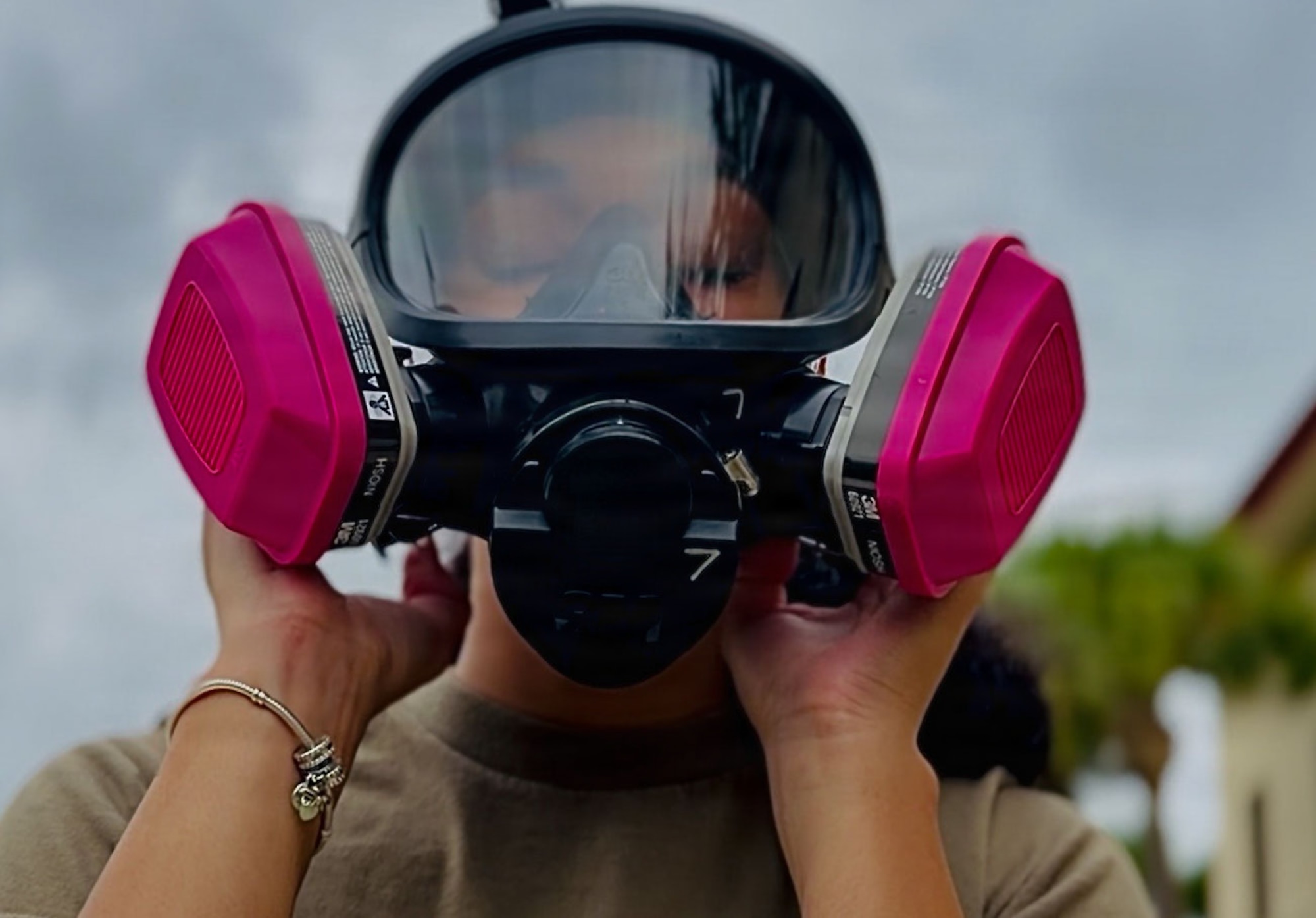 U.S. Air Force Airman 1st Class Emma Musser, 6th Operational Medical Readiness Squadron bioenvironmental engineering technician, doffing a full level C Hazmat suit at MacDill Air Force Base, Florida, July 30, 2026. The Bioenvironmental Engineering Flight oversees radiation safety programs and evaluates radiation hazards across the installation. (U.S. Air Force photo by Senior Airman Nelvis Sera)