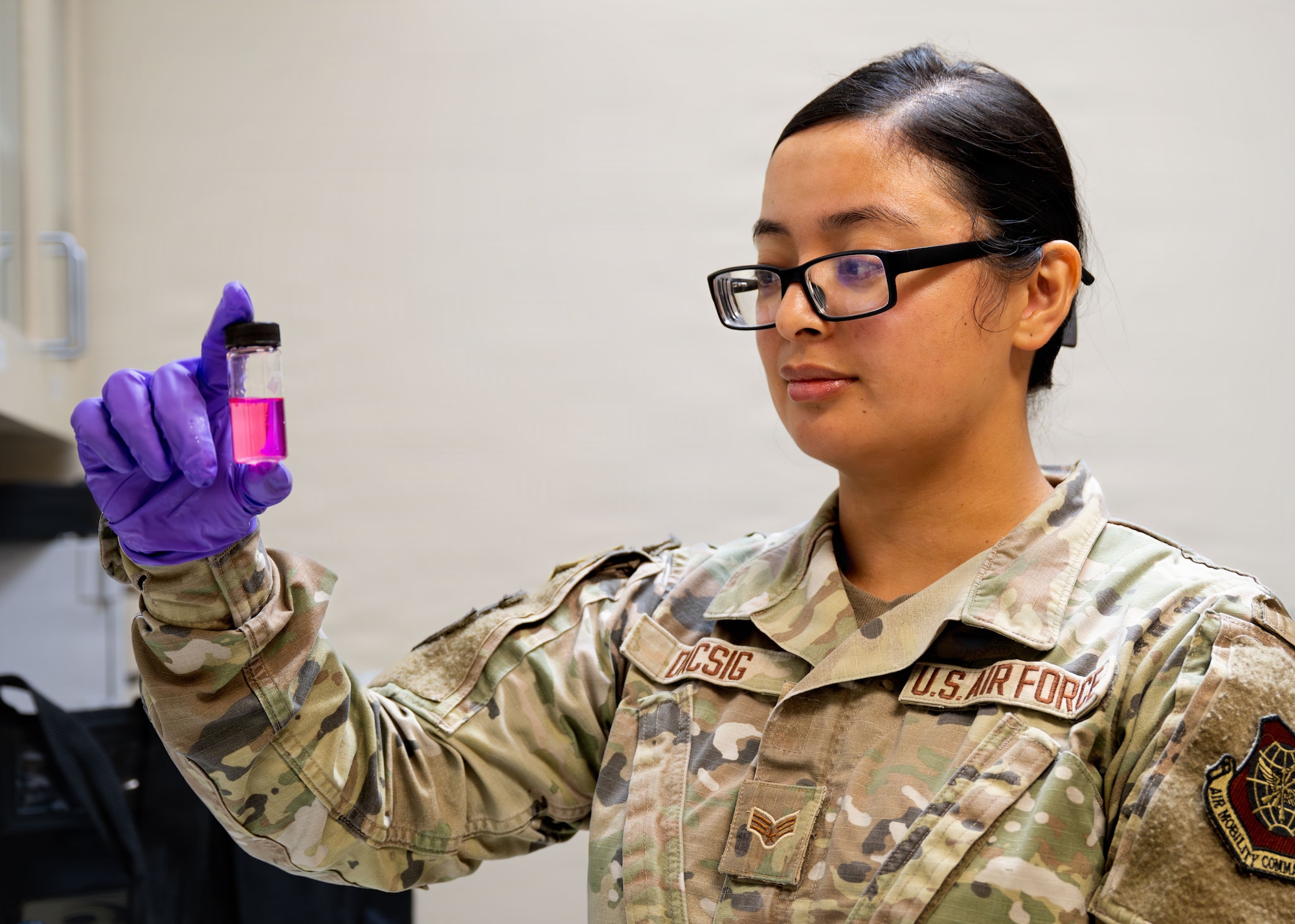 U.S. Air Force Senior Airman Gillian Dacsig, 6th Operational Medical Readiness Squadron bioenvironmental Engineering technician, checks the chlorine concentration of aircraft sampling points at MacDill Air Force Base, Florida, July 30, 2026. The Bioenvironmental Engineering Flight gathers data and inputs it directly into the Defense Occupational and Environmental Health Readiness System, or DOEHRS, to automatically populate the Individual Longitudinal Exposure Record, or ILER. (U.S. Air Force photo by Senior Airman Nelvis Sera)