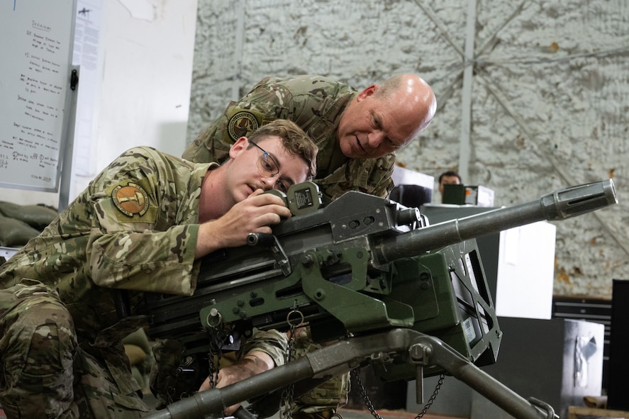 U.S. Air Force Gen. S.L. Davis, commander of Air Force Global Strike Command, receives a brief about the Mk 19 grenade launcher from Airman 1st Class Ayden Kozlowsky, a 91st Missile Security Operations Squadron member, at Minot Air Force Base, North Dakota, July 30, 2026.
