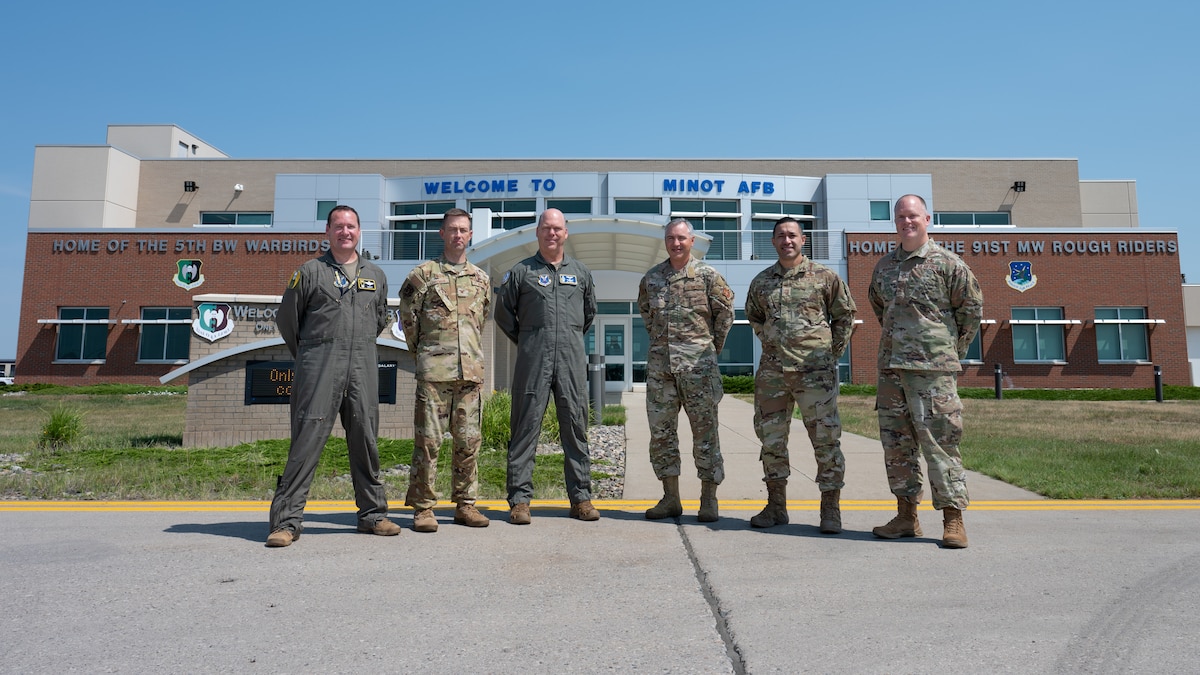 U.S. Air Force Gen. S.L. Davis, commander of Air Force Global Strike Command, and Chief Master Sgt. Shawn M. Aiello, command chief of AFGSC, pose for a photo with Team Minot leadership at Minot Air Force Base, North Dakota, July 31, 2026.