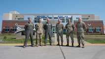 U.S. Air Force Gen. S.L. Davis, commander of Air Force Global Strike Command, and Chief Master Sgt. Shawn M. Aiello, command chief of AFGSC, pose for a photo with Team Minot leadership at Minot Air Force Base, North Dakota, July 31, 2026.