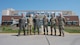 U.S. Air Force Gen. S.L. Davis, commander of Air Force Global Strike Command, and Chief Master Sgt. Shawn M. Aiello, command chief of AFGSC, pose for a photo with Team Minot leadership at Minot Air Force Base, North Dakota, July 31, 2026.