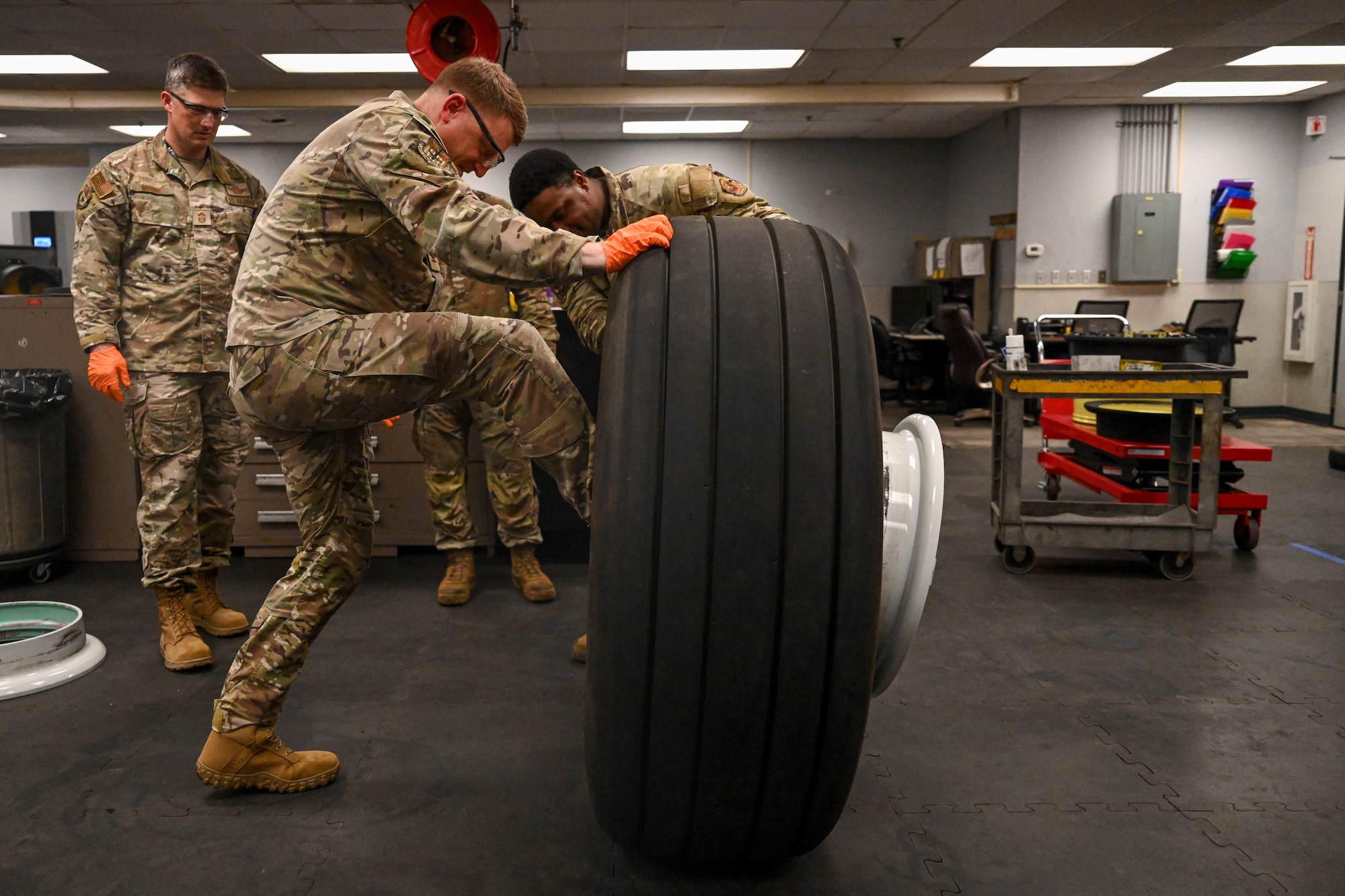 Col. Mark Hamilton, 1st Special Operations Wing commander, disassembles an aircraft wheel during a leadership immersion at Hurlburt Field, Florida, July 24, 2026.