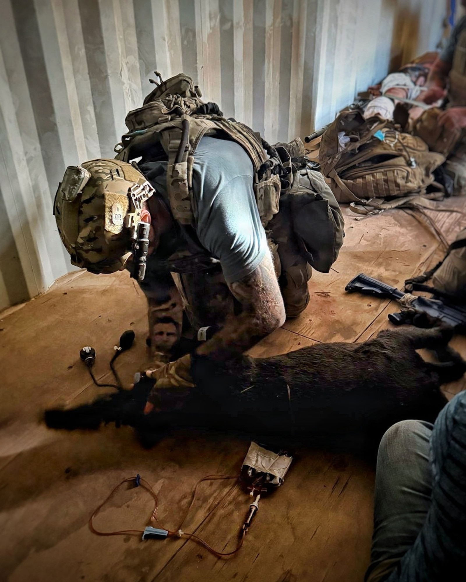 An Air Force medic treating a wound.