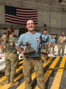 Photo of a person holding a trophy