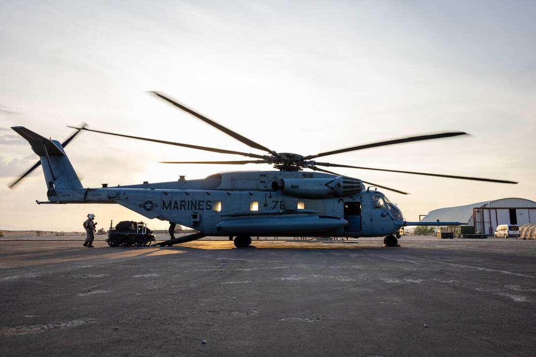 An HDT WOLF boards a CH-53E Super Stallion with Marine Heavy Helicopter Squadron 462, Marine Aircraft Group 39, 3rd Marine Aircraft Wing, during Service Level Training Exercise 4-26 on Marine Corps Air Ground Combat Center, Twentynine Palms, California, Aug. 10, 2026. SLTE 4-26 is designed to be a challenging, realistic training environment that produces combat-ready forces capable of operating as an integrated Marine Air Ground Task Force across all domains of military operations. (U.S. Marine Corps photo by Sgt. Alexis French)