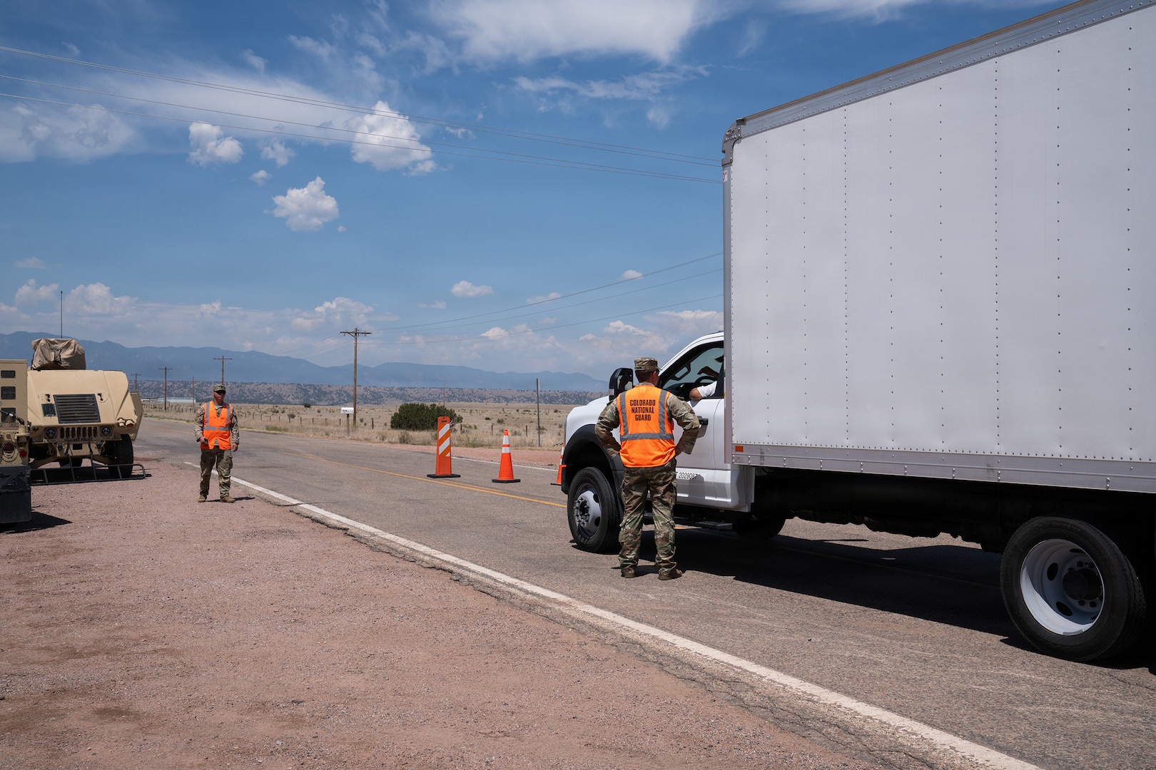 Members of the Colorado Army National Guard’s 220th Military Police Company support the Pueblo County Sheriff’s office, managing traffic control points for road closures and evacuated areas near the Aspen Acres Fire, Pueblo, Colorado, July 9, 2026.