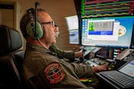 U.S. Air Force Master Sgt. Charles Skinner, a MQ-9 sensor operator assigned to the 108th Attack Squadron, 174th Attack Wing, operates an MQ-9 Reaper remotely piloted aircraft from Hancock Field Air National Guard Base in Syracuse, New York, July 9, 2026, during search and rescue operations over Lake Erie for a missing boater. The 174th Attack Wing employed the MQ-9's airborne sensors to support search efforts and assist agencies working to locate the missing boater. Photo by Tech. Sgt. Alexander Rector.