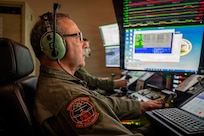 U.S. Air Force Master Sgt. Charles Skinner, a MQ-9 sensor operator assigned to the 108th Attack Squadron, 174th Attack Wing, operates an MQ-9 Reaper remotely piloted aircraft from Hancock Field Air National Guard Base in Syracuse, New York, July 9, 2026, during search and rescue operations over Lake Erie for a missing boater.
