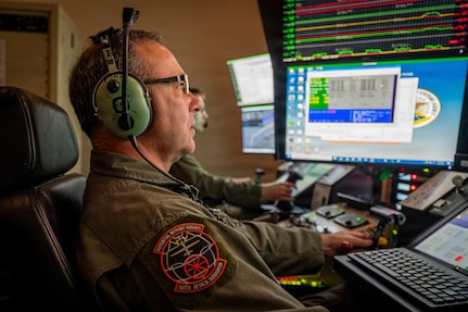 U.S. Air Force Master Sgt. Charles Skinner, a MQ-9 sensor operator assigned to the 108th Attack Squadron, 174th Attack Wing, operates an MQ-9 Reaper remotely piloted aircraft from Hancock Field Air National Guard Base in Syracuse, New York, July 9, 2026, during search and rescue operations over Lake Erie for a missing boater.
