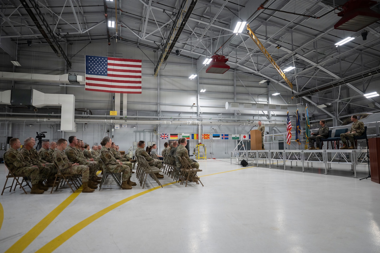 A photo of U.S. Air Force Chief Master Sgt Jeffrey Steadman, the outgoing command chief of the 158th Fighter Wing, addressing the crowd for the final time as the 158th Fighter Wing Command Chief during a change of responsibility ceremony at the Vermont Air National Guard Base, South Burlington, Vermont.