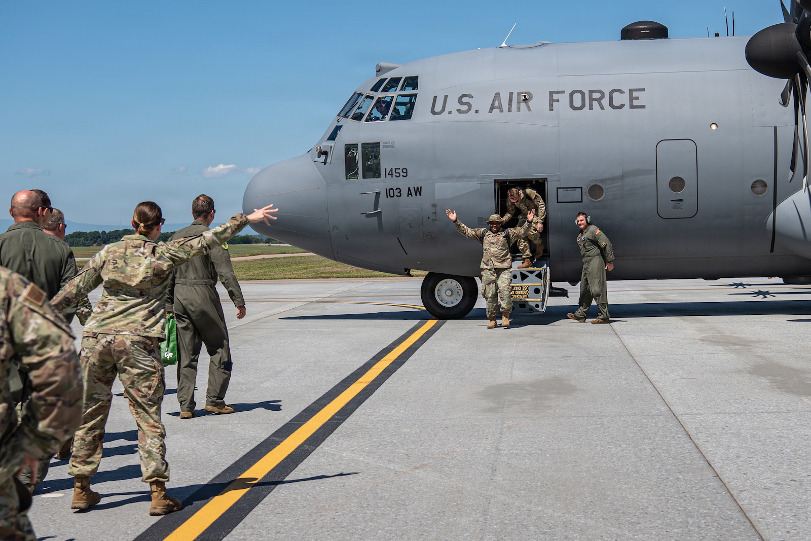 A photo of U.S. Air Force Airmen assigned to the 158th Fighter Wing returning from an overseas deployment, arriving back to the Vermont Air National Guard, South Burlington, VT.