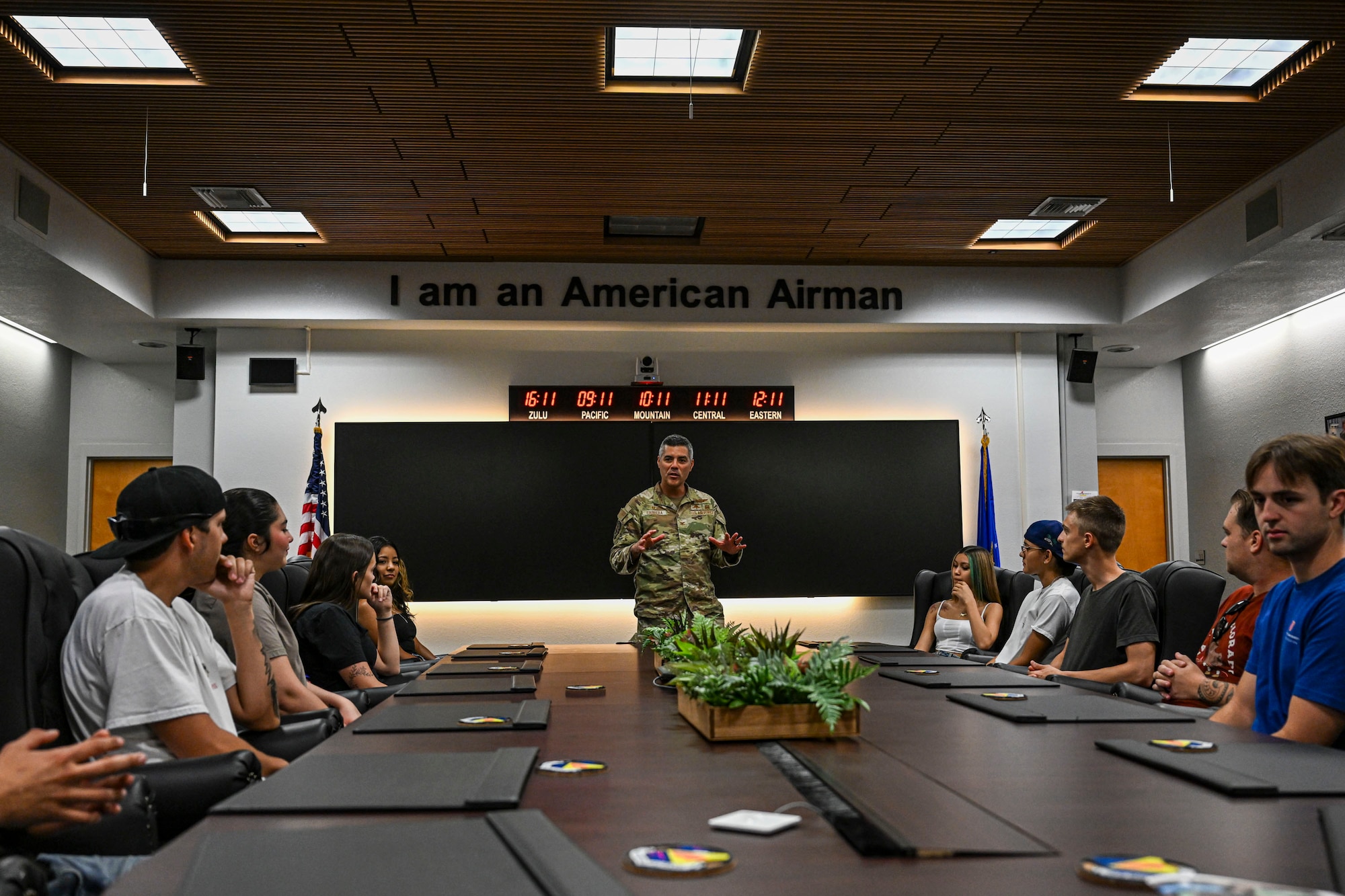 U.S. Airmen and Air Force Delayed Entry Program recruits pose for a group photo during a base tour at Davis-Monthan Air Force Base, Arizona, Aug. 7, 2026. Hosted by local recruiters, the event offered participants a firsthand look at the missions and people that support the 355th Wing. (U.S. Air Force photo by Airman 1st Class Samantha Melecio)