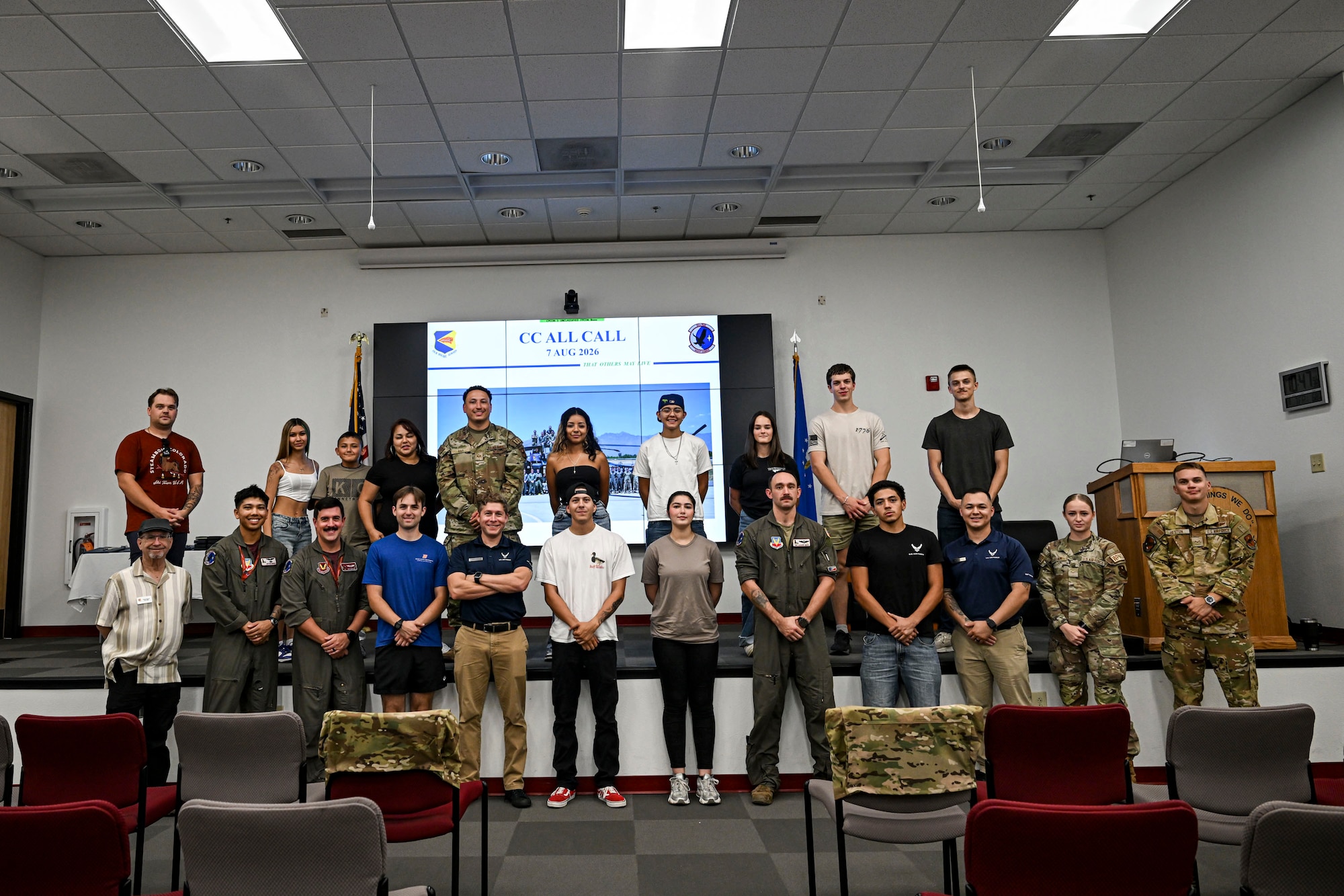 U.S. Airmen and Air Force Delayed Entry Program recruits pose for a group photo during a base tour at Davis-Monthan Air Force Base, Arizona, Aug. 7, 2026. Hosted by local recruiters, the event offered participants a firsthand look at the missions and people that support the 355th Wing. (U.S. Air Force photo by Airman 1st Class Samantha Melecio)
