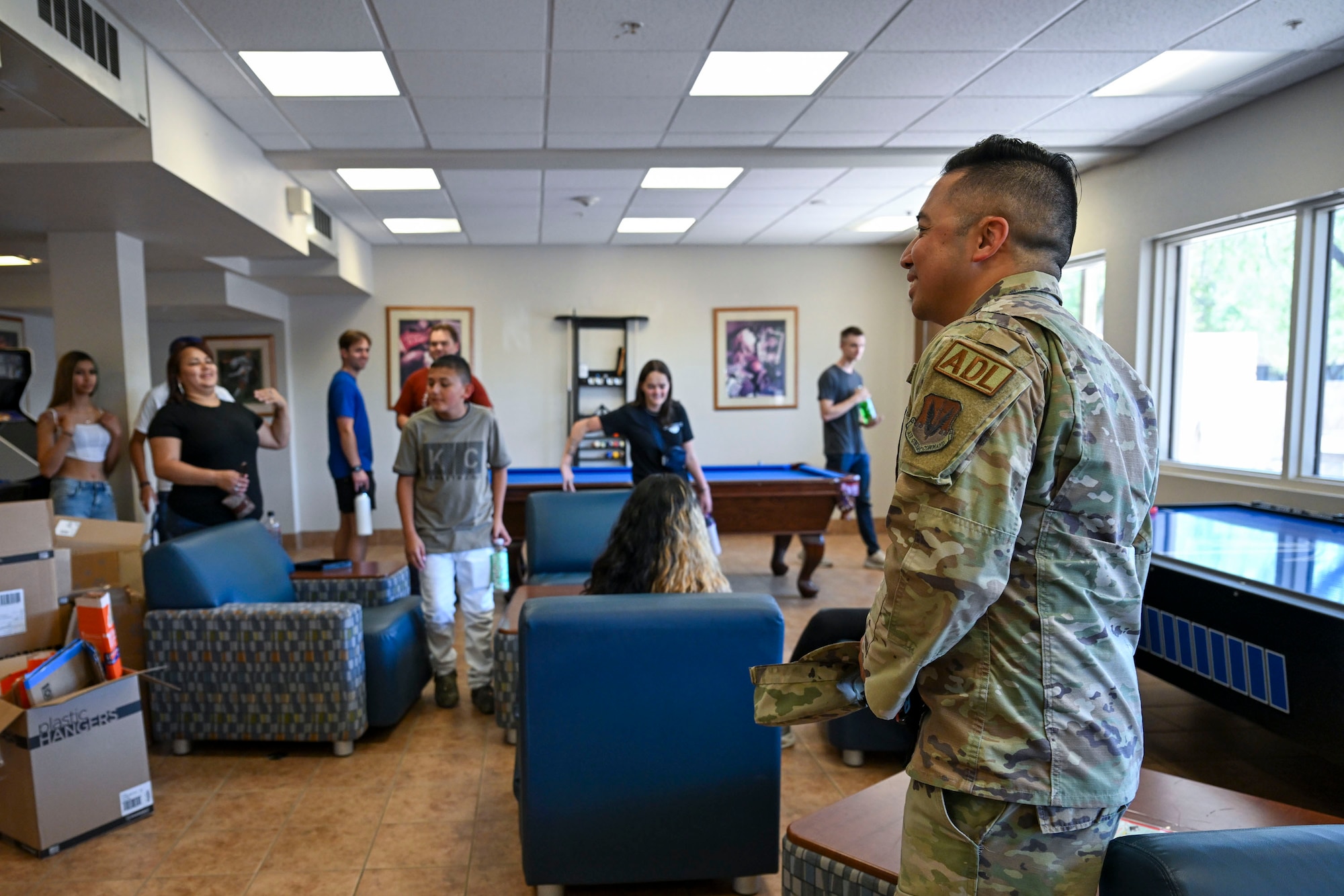 U.S. Airmen and Air Force Delayed Entry Program recruits pose for a group photo during a base tour at Davis-Monthan Air Force Base, Arizona, Aug. 7, 2026. Hosted by local recruiters, the event offered participants a firsthand look at the missions and people that support the 355th Wing. (U.S. Air Force photo by Airman 1st Class Samantha Melecio)