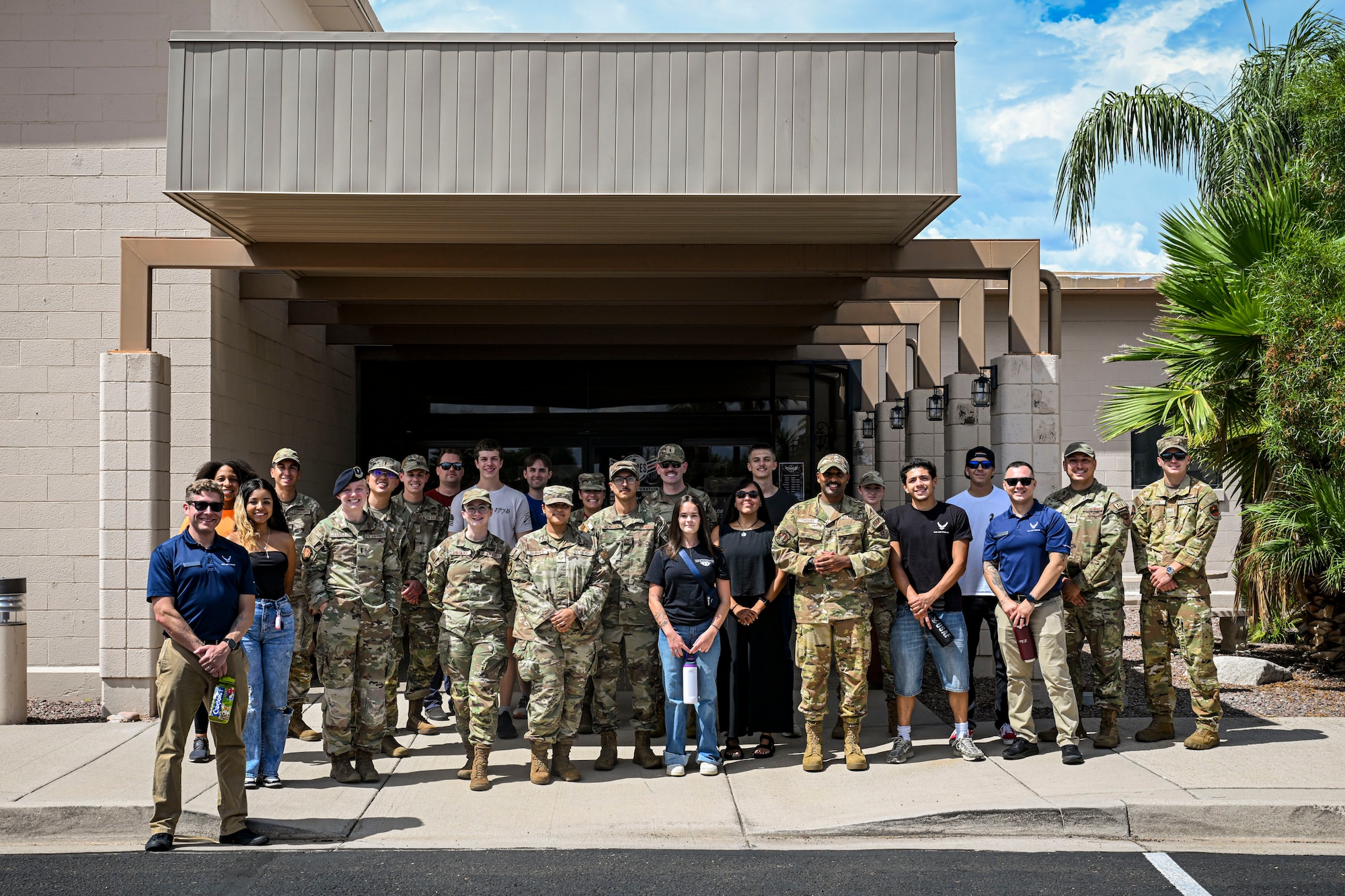 U.S. Airmen and Air Force Delayed Entry Program recruits pose for a group photo during a base tour at Davis-Monthan Air Force Base, Arizona, Aug. 7, 2026. Hosted by local recruiters, the event offered participants a firsthand look at the missions and people that support the 355th Wing. (U.S. Air Force photo by Airman 1st Class Samantha Melecio)