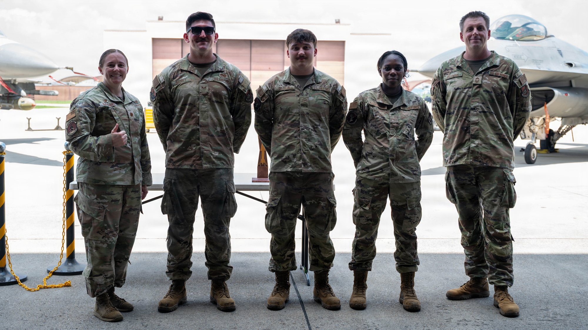 U.S. Air Force Airmen assigned to the 51st Munitions Squadron pose for a group photo after winning the 2nd Quarter Ammo Bomb Building and Loading Competition at Osan Air Base, Republic of Korea, Aug. 6, 2026. The competition tested the technical accuracy, adherence to safety protocols, team coordination, and loading time of the weapons load crews as they loaded munitions onto F-16 Fighting Falcons. (U.S. Air Force photo by Senior Airman Jessica Mun)