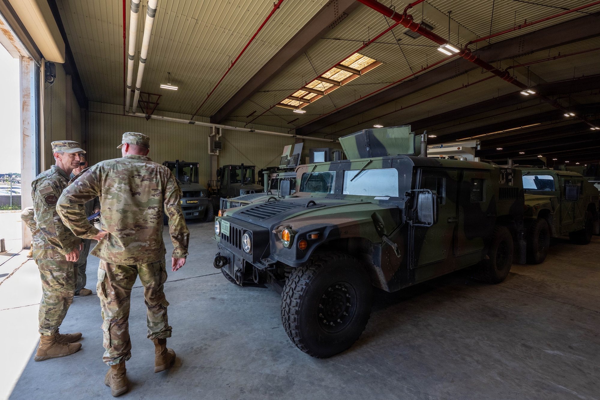 Gen. Schneider receives tour of warehouse.