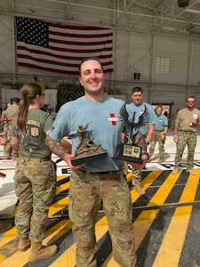 Photo of a person holding a trophy