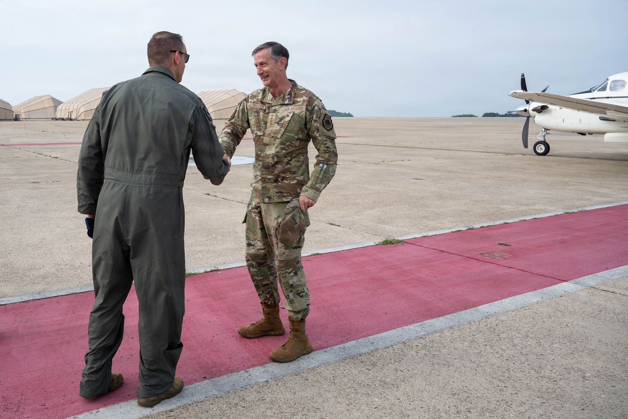 Col. DeLion greets Gen. Schneider.