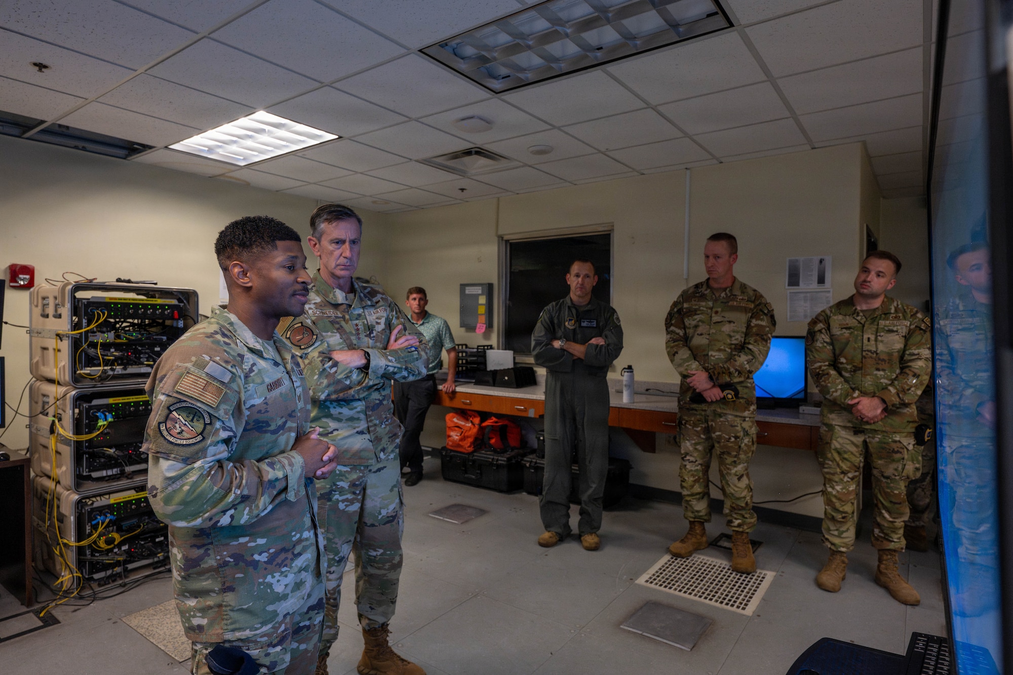 Gen. Schneider is briefed on drones.