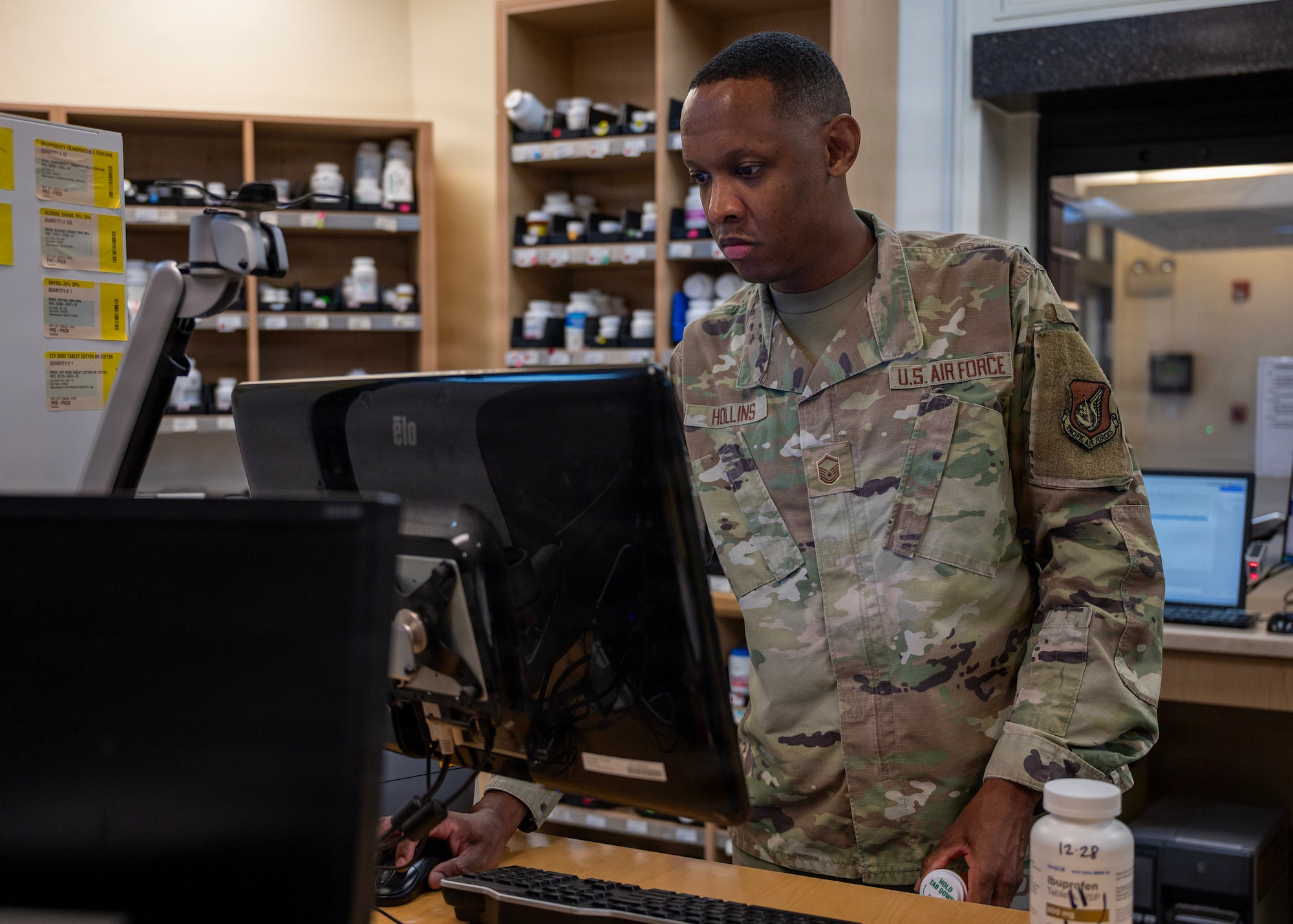 U.S. Air Force Master Sgt. Marcus Hollins, 51st Medical Support Squadron pharmacy operations section chief, checks a prescription at Osan Air Base, Republic of Korea, Aug. 12, 2026. Hollins was recognized as the Mustang of the Week for going the extra mile to make sure those he leads, coaches or interacts with always feels important and recognized. (U.S. Air Force photo by Staff Sgt. Sarah Williams)