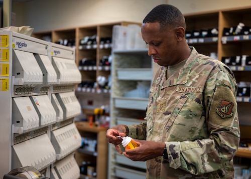 U.S. Air Force Master Sgt. Marcus Hollins, 51st Medical Support Squadron pharmacy operations section chief, labels a prescription bottle at Osan Air Base, Republic of Korea, Aug. 12, 2026. Hollins was recognized as the Mustang of the Week for going the extra mile to make sure those he leads, coaches or interacts with always feels important and recognized. (U.S. Air Force photo by Staff Sgt. Sarah Williams)