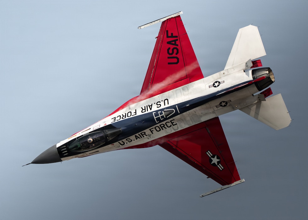 Maj. Taylor Hiester, F-16 Viper Demonstration Team commander and pilot, performs aerial maneuvers in an F-16C Fighting Falcon during AirVenture at Oshkosh, Wis., July 24, 2026. The F-16 is a multirole fighter capable of air-to-air and air-to-ground combat, and its dynamic demonstrations showcase the aircraft’s versatility across the United States and abroad. (U.S. Air Force photo by Staff Sgt. Steven Cardo)