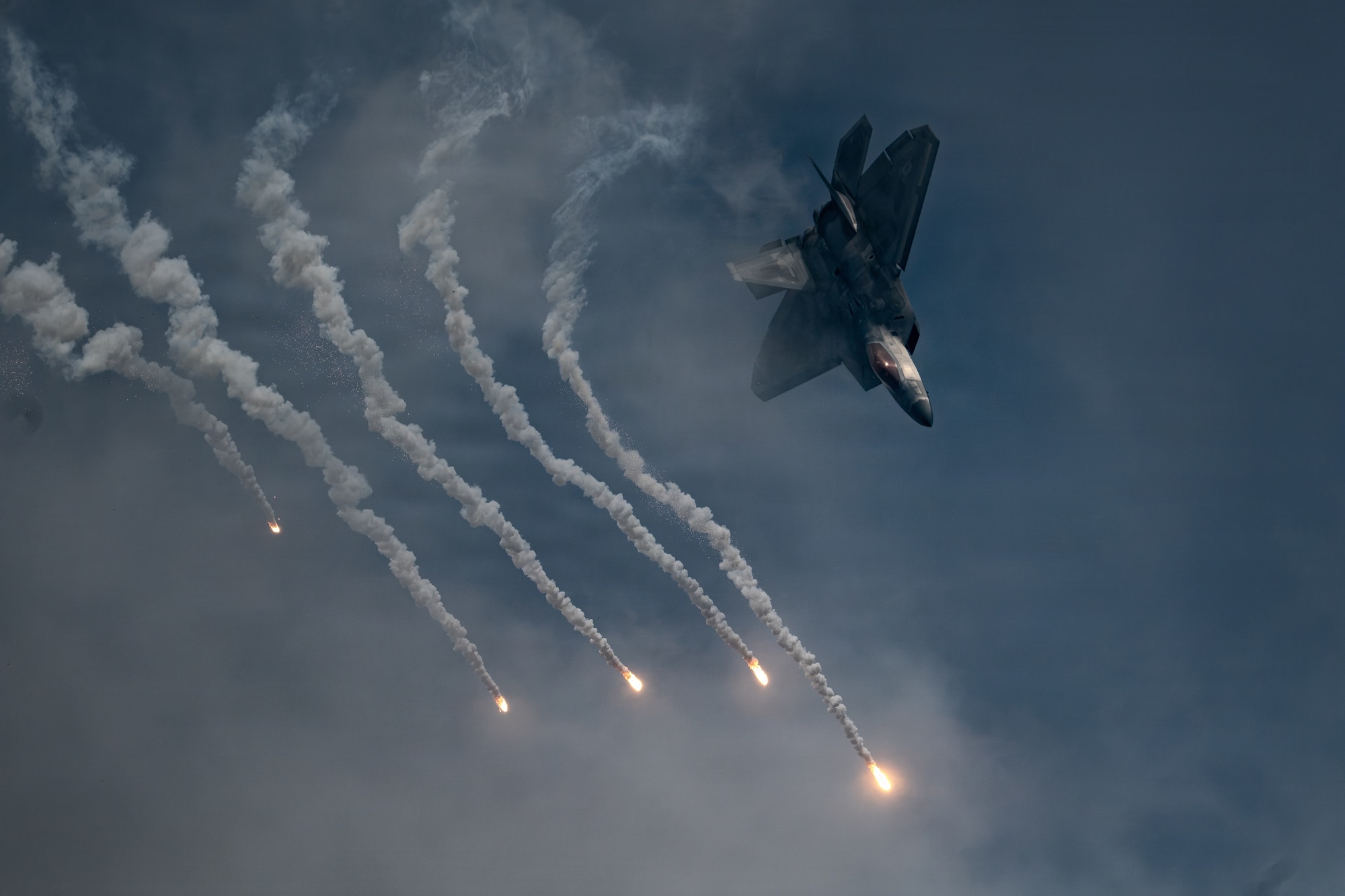 An F-22 Raptor assigned to the Air Force F-22 Raptor Demonstration Team performs during the Arctic Thunder Open House at Joint Base Elmendorf-Richardson, Alaska, Aug. 8, 2026. The team performs precision aerial maneuvers at air shows and open houses worldwide to demonstrate the capabilities of the fifth-generation fighter aircraft. (U.S. Air National Guard photo by Staff Sgt. Joseph Moon)