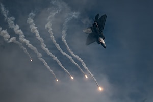 An F-22 Raptor assigned to the Air Force F-22 Raptor Demonstration Team performs during the Arctic Thunder Open House at Joint Base Elmendorf-Richardson, Alaska, Aug. 8, 2026. The team performs precision aerial maneuvers at air shows and open houses worldwide to demonstrate the capabilities of the fifth-generation fighter aircraft. (U.S. Air National Guard photo by Staff Sgt. Joseph Moon)