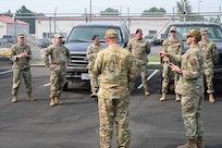 Airmen from the 173rd Fighter Wing receive their initial briefing before departing to the evacuation zones in Klamath Falls, Oregon, Aug. 10, 2026.