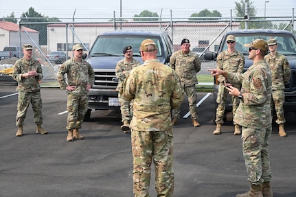 Airmen from the 173rd Fighter Wing receive their initial briefing before departing to the evacuation zones in Klamath Falls, Oregon, Aug. 10, 2026.