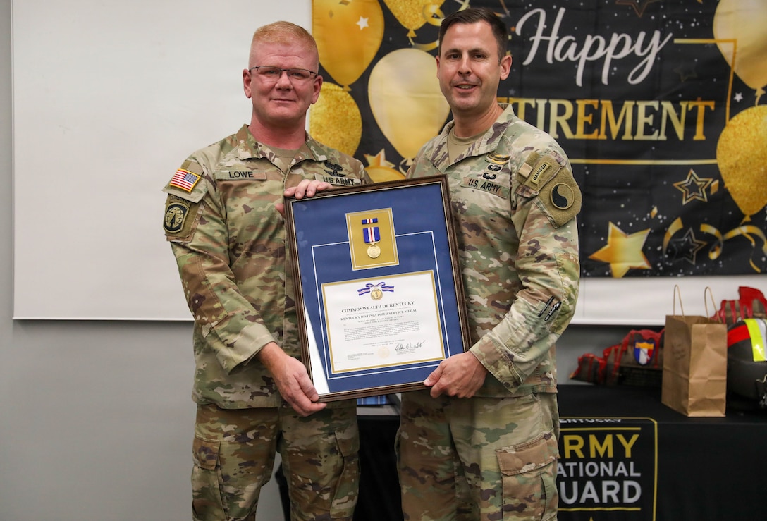 U.S. Army Lt. Col. Michael Moynahan, Kentucky Army National Guard’s state training officer, presents Sgt. 1st Class Jeremy Lowe with the Kentucky Distinguished Service Medal during his retirement ceremony, July 29, 2026.