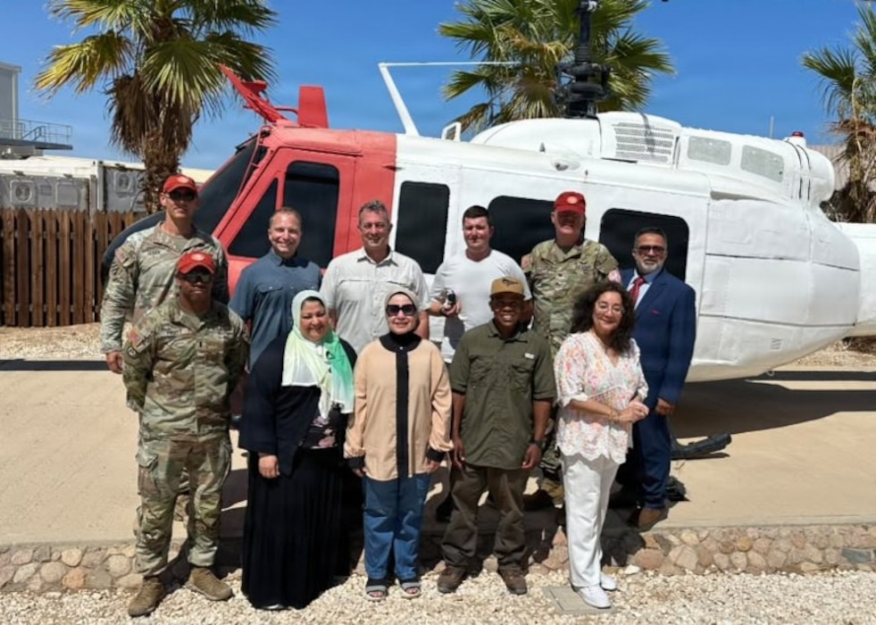 SINAI, Egypt (July 13, 2026) Representatives from the Multinational Force and Observers and U.S. Naval Medical Research Unit (NAMRU) EURAFCENT pose for a group photo during a visit to South Camp. The engagement provided an opportunity to discuss ongoing force health protection efforts, vector-borne disease surveillance activities, and continued collaboration in support of U.S and partner nation personnel serving in the region. NAMRU EURAFCENT, part of Navy Medicine Research & Development, conducts research, surveillance and studies of vaccines, therapeutic agents, diagnostic assays and vector control measures in the EUCOM, AFRICOM and CENTCOM Areas of Responsibility to better prevent and treat infectious diseases in support of Navy, Marine Corps and joint U.S. warfighter health, readiness and lethality. (U.S. Navy photo by Cmdr. Micah Kinney/Released)