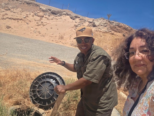 SINAI, Egypt (July 13, 2026) Capt. Wilbert Paige, preventive medicine officer for Multinational Force and Observers, and Alia Zayed, entomology advisor for U.S. Naval Medical Research Unit (NAMRU) EURAFCENT, inspect a concealed area that may serve as a mosquito breeding site during a vector surveillance assessment. Surveillance activities help identify environmental conditions that may contribute to vector-borne disease risks affecting deployed personnel. NAMRU EURAFCENT, part of Navy Medicine Research & Development, conducts research, surveillance and studies of vaccines, therapeutic agents, diagnostic assays and vector control measures in the EUCOM, AFRICOM and CENTCOM Areas of Responsibility to better prevent and treat infectious diseases in support of Navy, Marine Corps and joint U.S. warfighter health, readiness and lethality. (U.S. Navy Courtesy Photo/Released)
