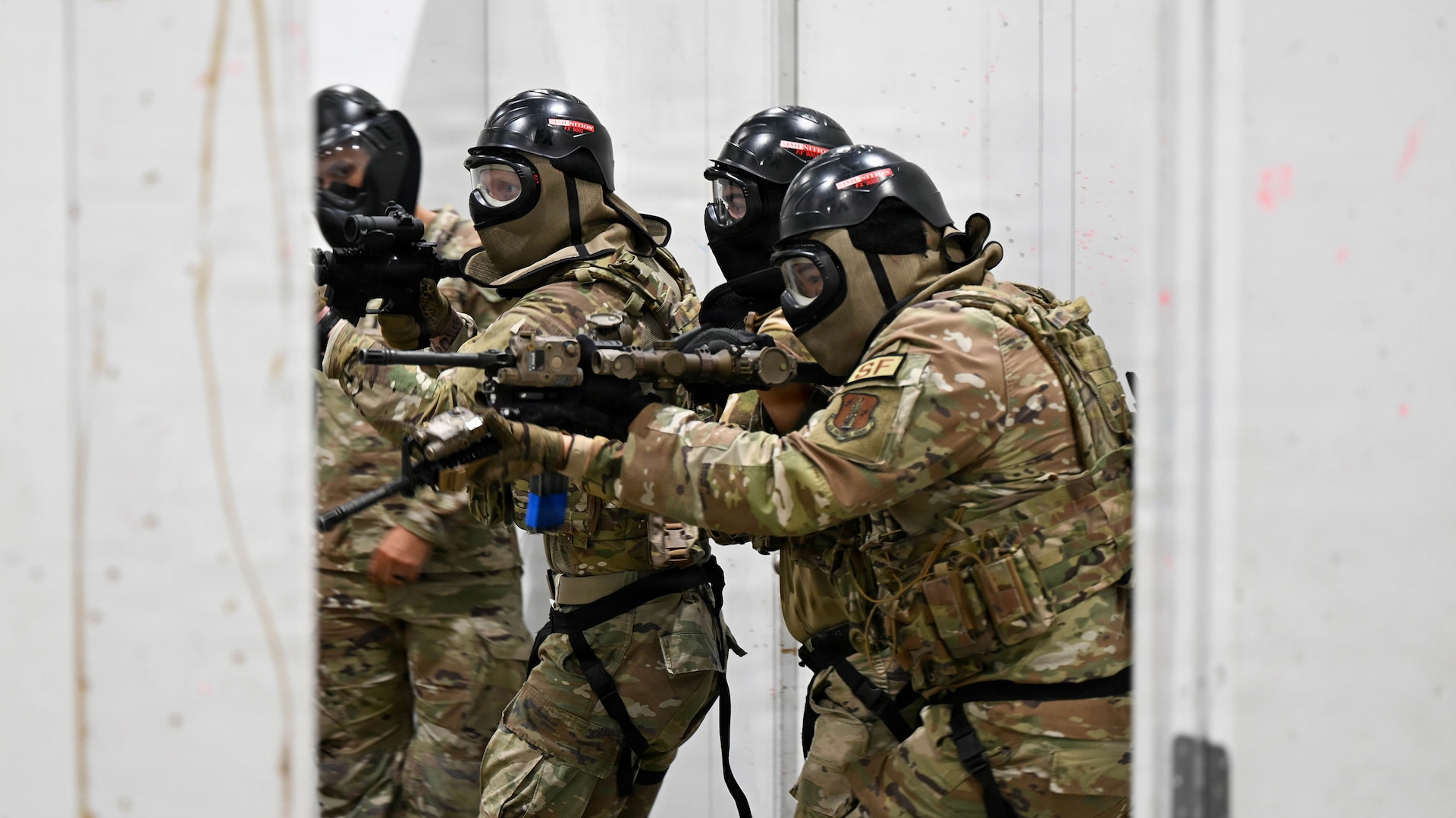 A team of New York Air National Guardsmen assigned to 107th Security Forces squadron engage a armed role player during a room clearing training scenario at Joint Base Elmendorf-Richarson, Alaska, July 18, 2026.