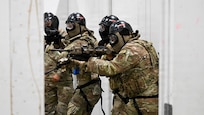 A team of New York Air National Guardsmen assigned to 107th Security Forces squadron engage a armed role player during a room clearing training scenario at Joint Base Elmendorf-Richarson, Alaska, July 18, 2026.