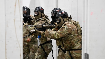 A team of New York Air National Guardsmen assigned to 107th Security Forces squadron engage a armed role player during a room clearing training scenario at Joint Base Elmendorf-Richarson, Alaska, July 18, 2026.