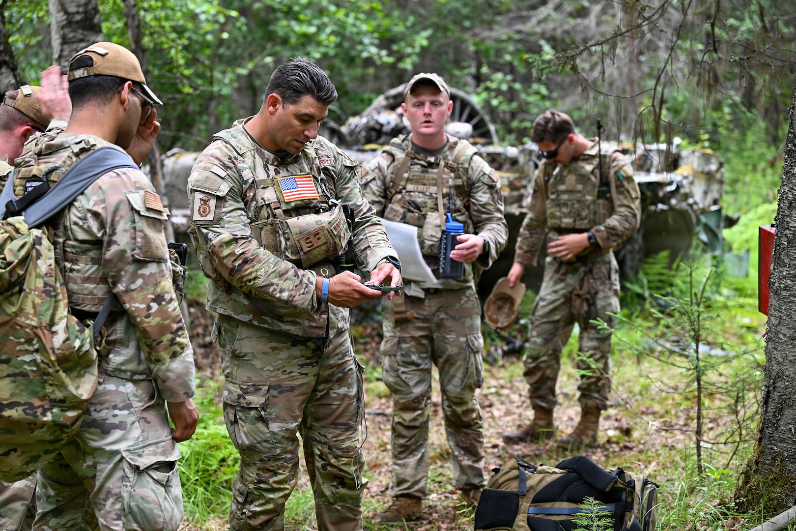 New York Air National Guardsmen assigned to 107th Security Forces squadron begin to set coordinates for their next checkpoint during a land navigation exercise at Joint Base Elmendorf-Richarson, Alaska, July 16, 2026.