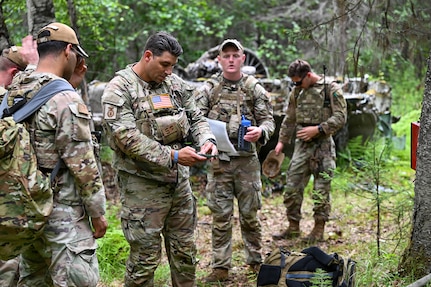 New York Air National Guardsmen assigned to 107th Security Forces squadron begin to set coordinates for their next checkpoint during a land navigation exercise at Joint Base Elmendorf-Richarson, Alaska, July 16, 2026.