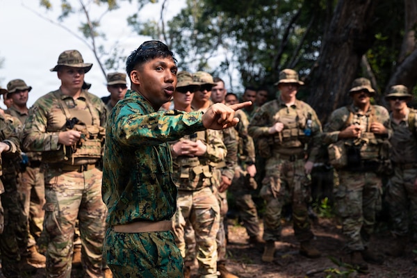 Lance Cpl. Mohammad Izzat bin Awang Mohammad from RBLF instructs Oklahoma Army National Guard Soldiers with 1st Squadron, 180th Cavalry Regiment, 45th Infantry Brigade Combat Team, on establishing their pace count during jungle land navigation training at Exercise Pahlawan Warrior 26 at Tutong Camp, Brunei Darussalam, Aug. 12, 2026. Exercise Pahlawan Warrior is a biennial bilateral exercise between the U.S. Army Pacific and the RBLF, designed to enhance readiness, interoperability, and strengthen bilateral defense cooperation. (Oklahoma National Guard photo by Sgt. Danielle Rayon)