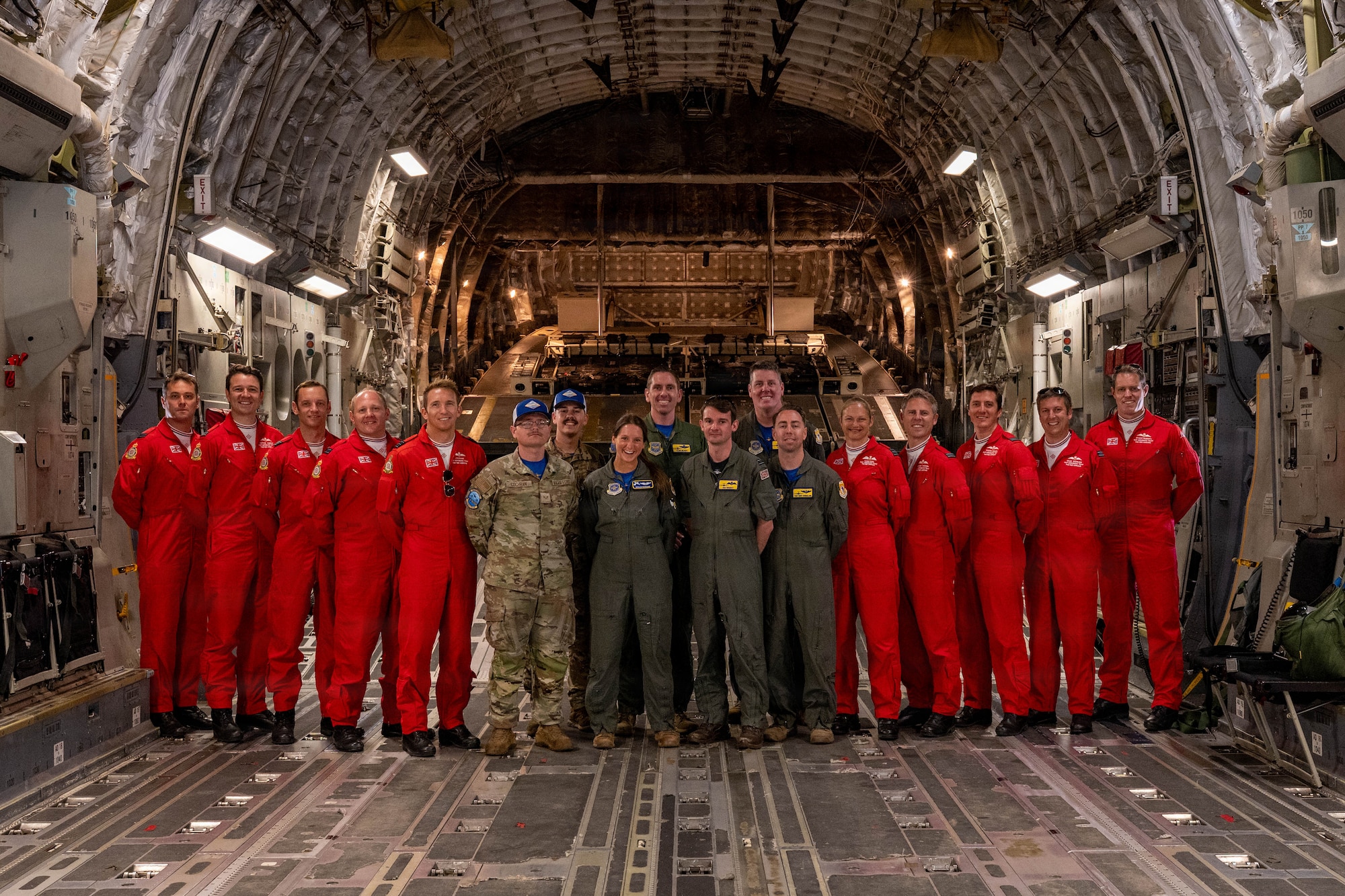 Members of the U.S. Air Force C-17 East Coast Demo Team pose for a photo with the Royal Air Force Red Arrows during the Great State of Maine Air Show in Brunswick, Maine, July 12th, 2026. The aerobatic team participated in a month-long tour, commemorating 250 years of American independence and highlighting the enduring partnership between the United Kingdom and the United States. (U.S. Air Force photo by Staff Sgt. Zachary Wright)