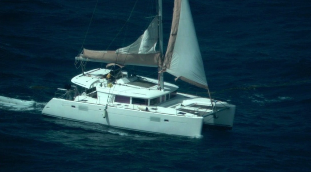Photo taken by U.S. Coast Guard Air Station Miami HC-144 Ocean Sentry aircrew of an overdue sailing catamaran and Peter Baron shortly before his rescue by a Dutch Coast Guard marine unit, approximately 11 nautical miles west of Sint Maarten, Aug.13, 2026.  “I am incredibly proud of our Coast Guard servicemembers and commend the phenomenal efforts of our French, Dutch, and Virgin Islands partners, which ensured this mariner’s safe return to his family,” said Cmdr. Matthew Romano, Coast Guard Search and Rescue mission coordinator for the case. (U.S. Coast Guard photo)