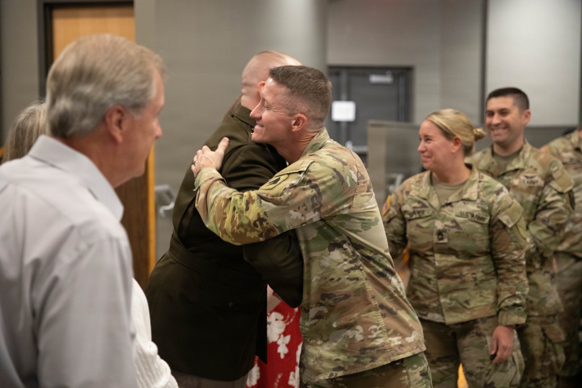 U.S. Army Maj. Cody Stagner congratulates Lt. Col. Honeycutt on his promotion following a ceremony at Boone National Guard Center in Frankfort, June 24. Family, friends and fellow Soldiers gathered for the ceremony. (U.S. Army National Guard photo by Milt Spalding)