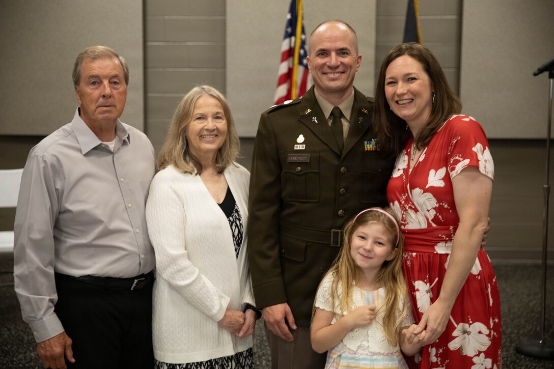 U.S. Army Lt. Col. Eric Honeycutt with his family following a promotion ceremony at Boone National Guard Center in Frankfort, June 24. Family, friends and fellow Soldiers gathered for the ceremony. (U.S. Army National Guard photo by Milt Spalding)