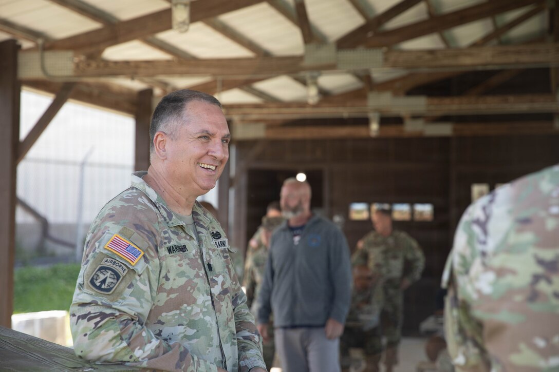 U.S. Army Lt. Col. Jimmie Warinner listens to Brig. Gen. Brian Wertzler during a cookout in honor of the Kentucky National Guard’s 234th birthday at Boone National Guard Center in Frankfort, June 24. Soldiers, Airmen and civilians gathered to celebrate the organization's longstanding tradition of service to the Commonwealth and nation and continued commitment to homeland defense, emergency response and warfighting readiness. (U.S. Army National Guard photo by Milt Spalding)