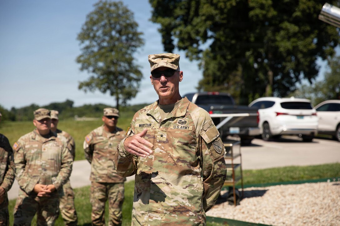 U.S. Army Brig. Gen. Brian Wertzler speaks to Soldiers, Airmen and Civilians gathered before a ceremonial cake-cutting during a birthday celebration at Boone National Guard Center in Frankfort, June 24. Soldiers, Airmen and civilians gathered to celebrate the organization's longstanding tradition of service to the Commonwealth and nation and continued commitment to homeland defense, emergency response and warfighting readiness. (U.S. Army National Guard photo by Milt Spalding)