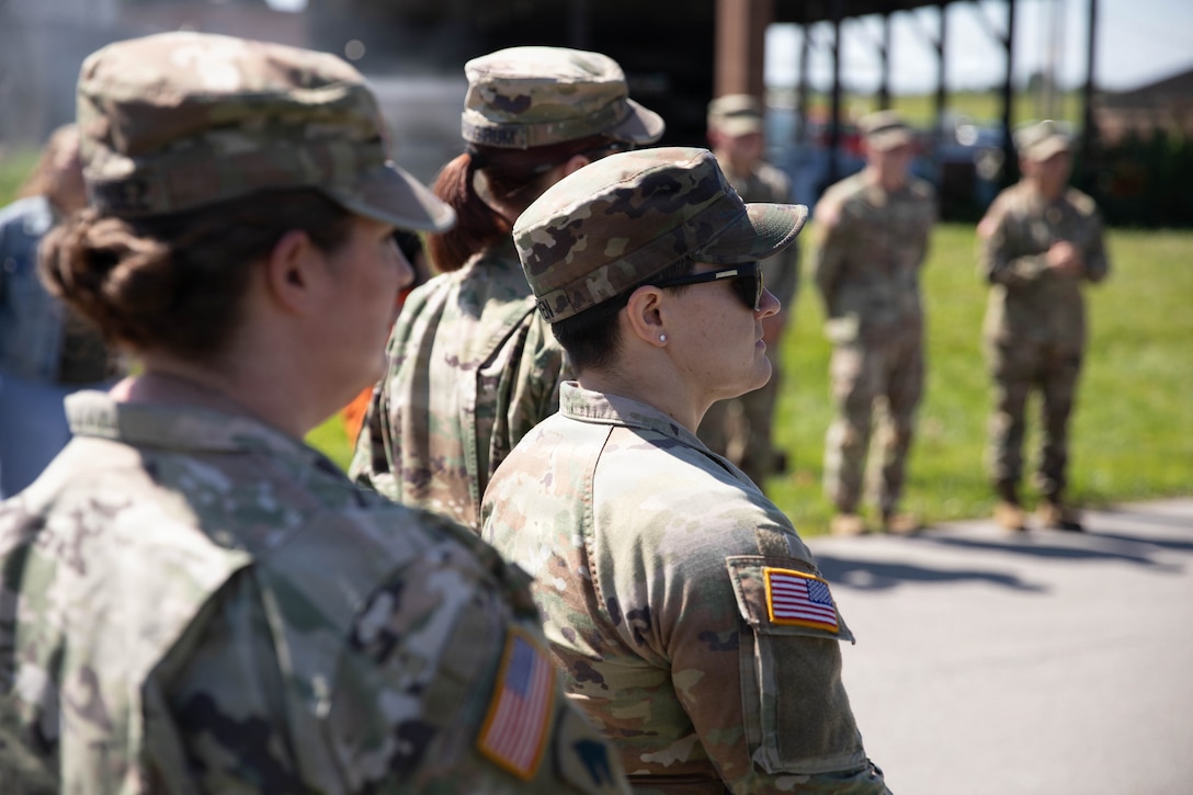 U.S. Army Sgt. 1st Class Anna Hernandez and Sgt. 1st Class Jayda Bowen listen as Brig. Gen. Brian Wertzler speaks before a ceremonial cake-cutting during a birthday celebration at Boone National Guard Center in Frankfort, June 24. Soldiers, Airmen and civilians gathered to celebrate the organization's longstanding tradition of service to the Commonwealth and nation and continued commitment to homeland defense, emergency response and warfighting readiness. (U.S. Army National Guard photo by Milt Spalding)