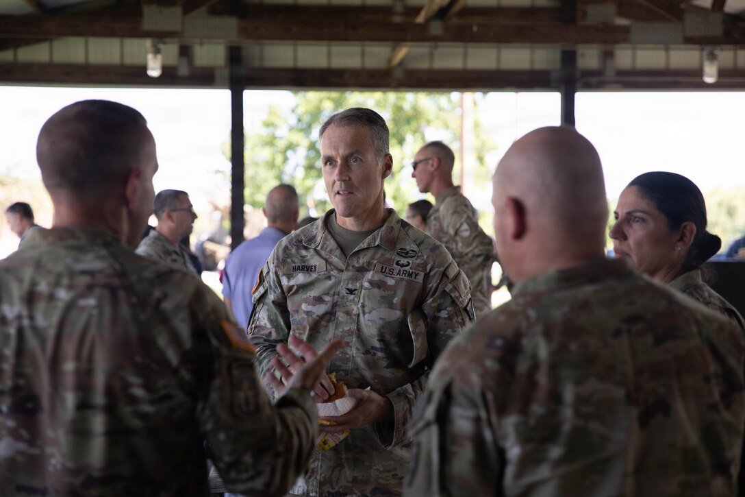 U.S. Army Col. John Harvey talks with fellow Soldiers during a cookout in honor of the Kentucky National Guard’s 234th birthday at Boone National Guard Center in Frankfort, June 24. Soldiers, Airmen and civilians gathered to celebrate the organization's longstanding tradition of service to the Commonwealth and nation and continued commitment to homeland defense, emergency response and warfighting readiness. (U.S. Army National Guard photo by Milt Spalding)