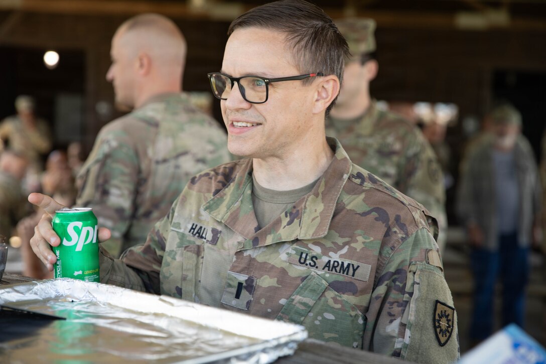 U.S. Army 1st Lt. Patrick Hall talks with fellow Soldiers during a cookout in honor of the Kentucky National Guard’s 234th birthday at Boone National Guard Center in Frankfort, June 24. Soldiers, Airmen and civilians gathered to celebrate the organization's longstanding tradition of service to the Commonwealth and nation and continued commitment to homeland defense, emergency response and warfighting readiness. (U.S. Army National Guard photo by Milt Spalding)